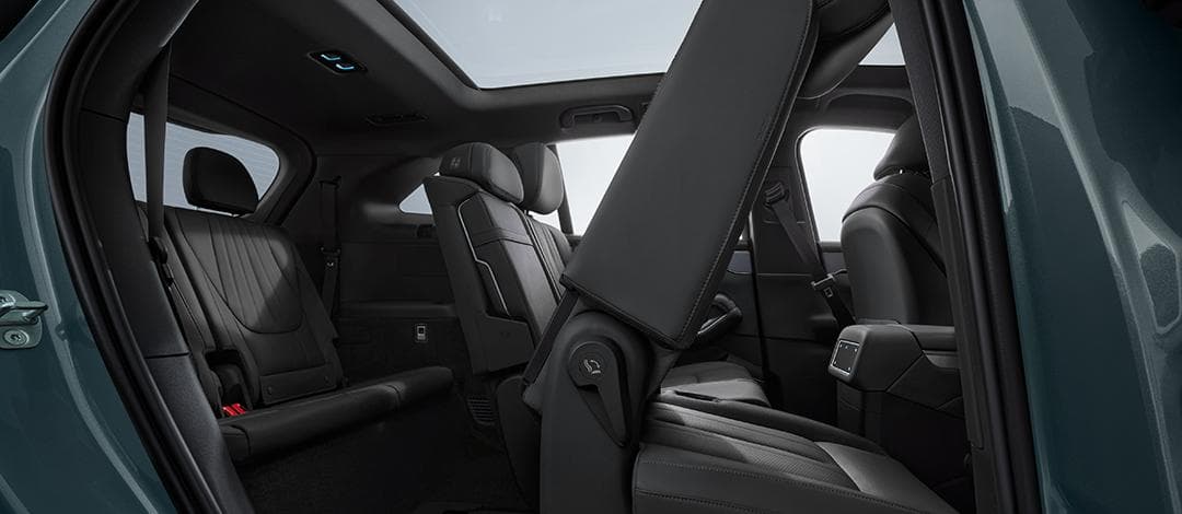 BYD Atto 8 seven-seat cabin showing the second and third rows of the electric SUV.